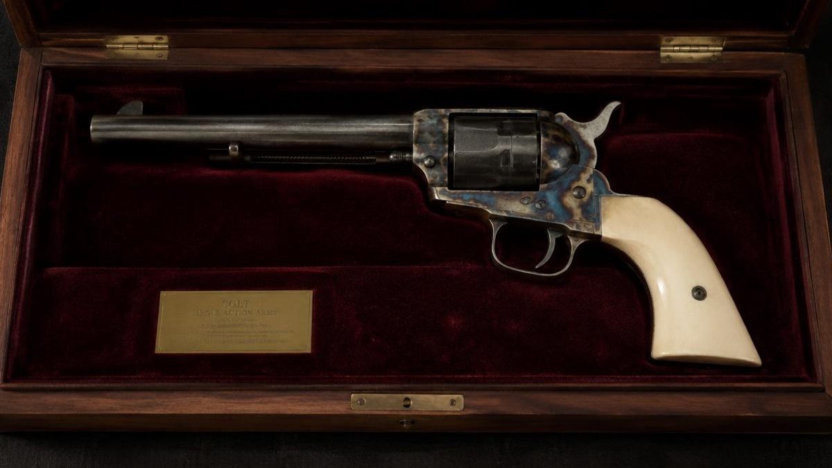 Classic single action revolver displayed in a velvet-lined presentation case